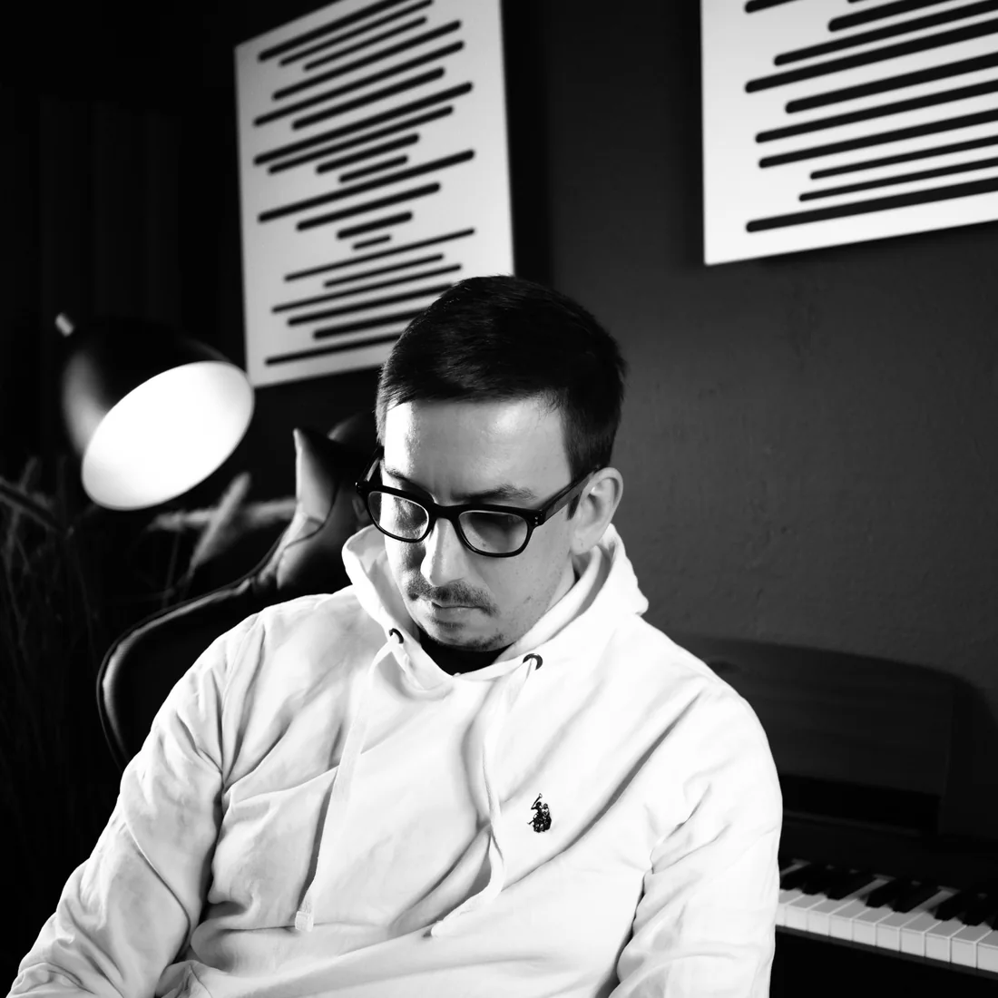 Florian Bur in his studio, next to the piano
